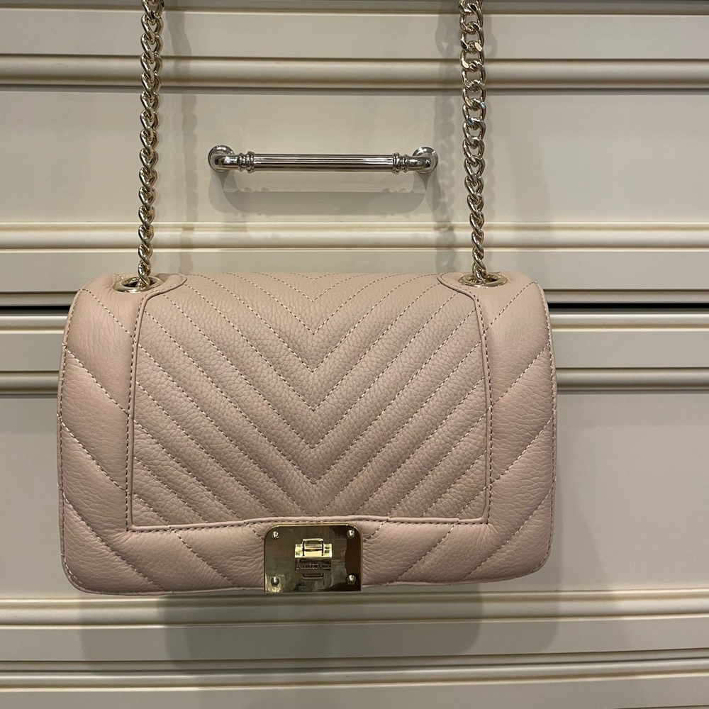 NEW. Karl Lagerfield Nude shoulder bag with gold chain strap.
